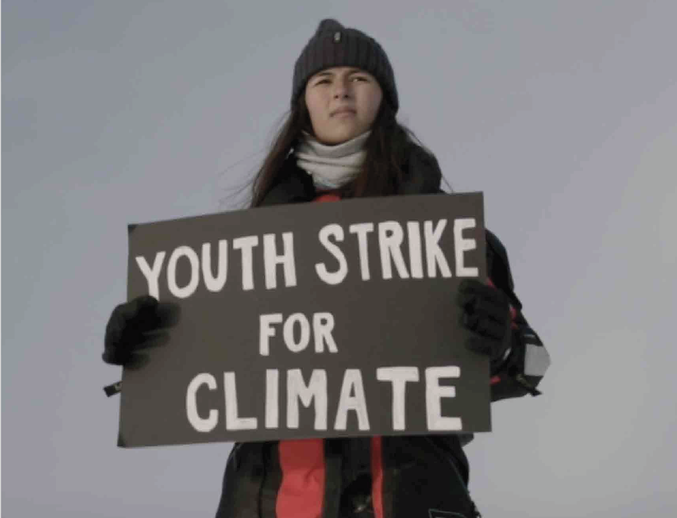 Girl holds sign saying "Youth Strike for Climate"