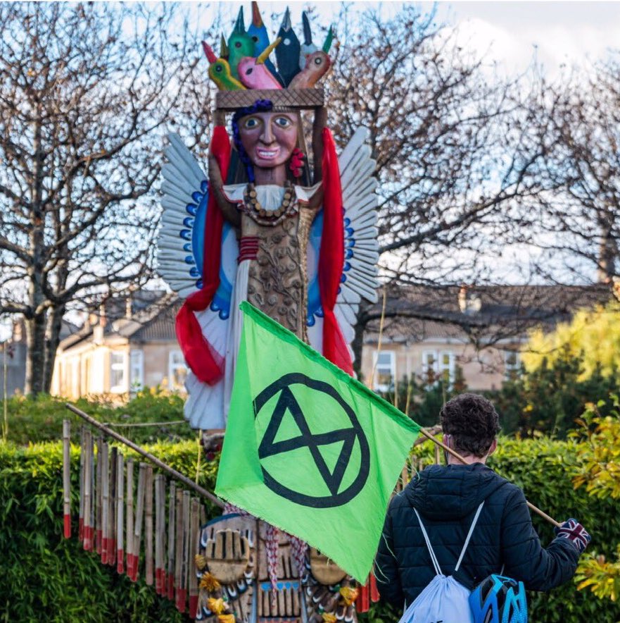 Totem with Extinction rebellion protestor